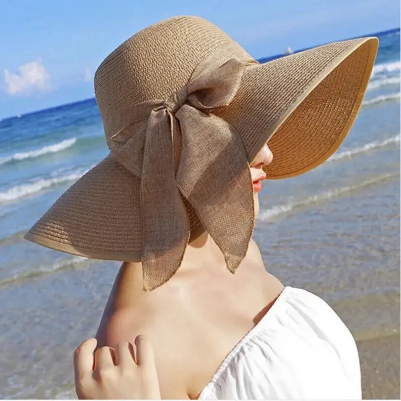 Stylishly enjoy summer with the FAITOLAGIC Summer Women Straw Hat Bowknot Wide Brim Floppy Panama Hats for beach outings.