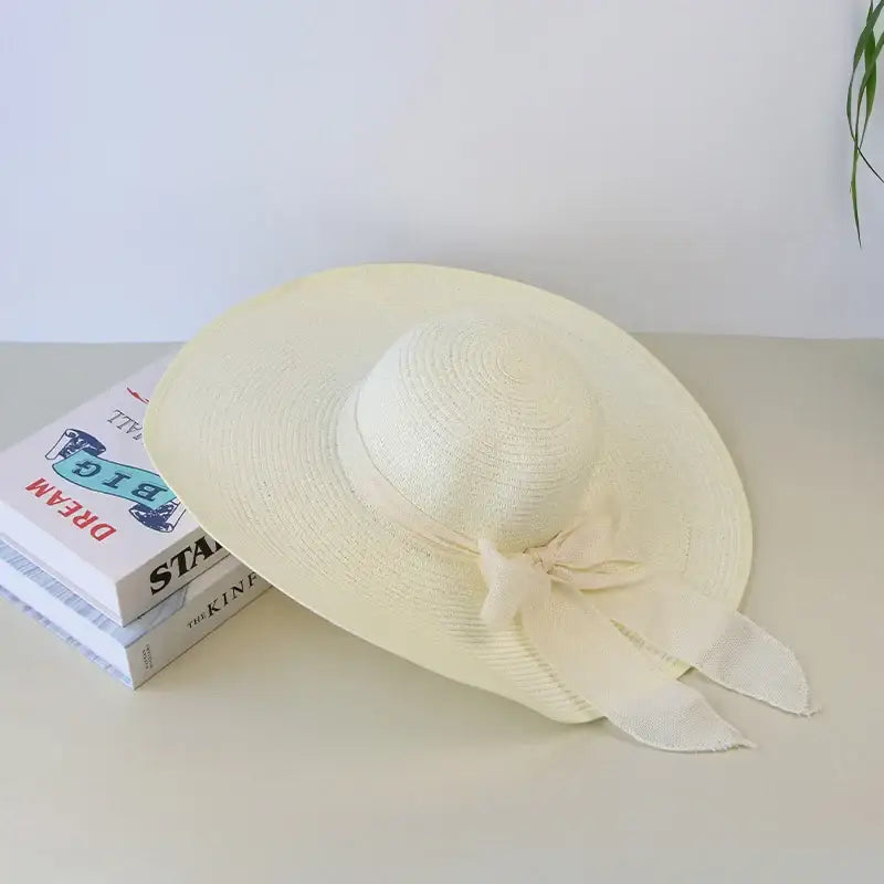 Stylish Summer Women Straw Hat Bowknot Wide Brim Floppy Panama Hats for outdoor beach fun by FAITOLAGIC.