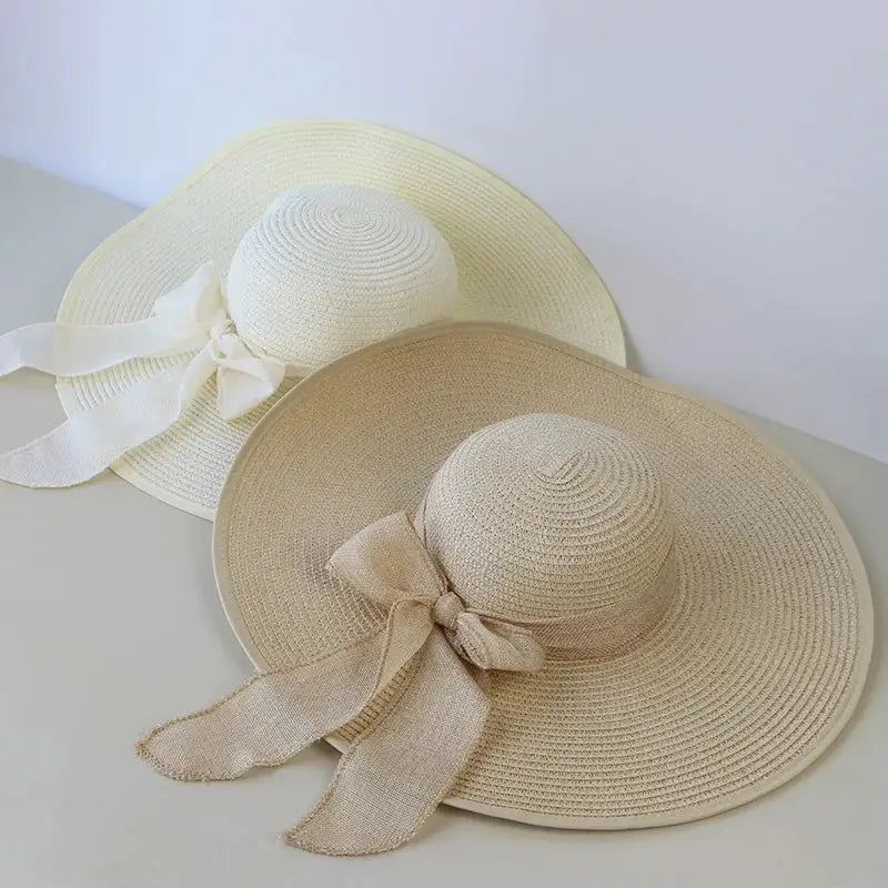 Stylish Summer Women Straw Hat Bowknot Wide Brim Floppy Panama Hats for outdoor fun and sun protection by FAITOLAG.