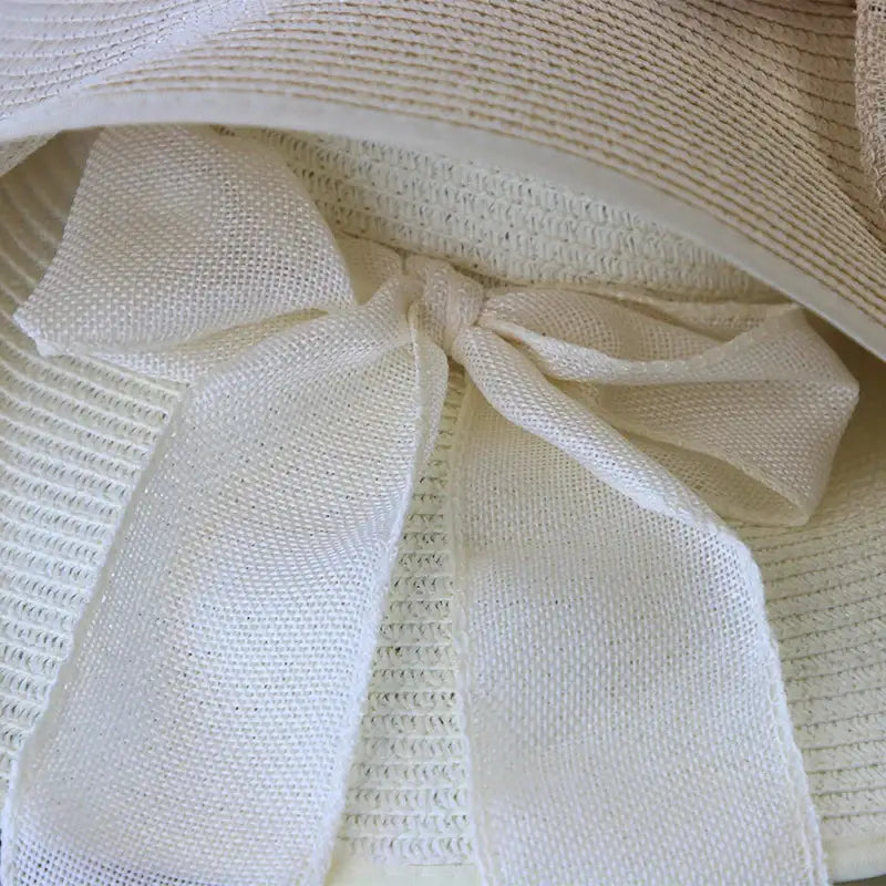 Stylish Summer Women Straw Hat Bowknot Wide Brim Floppy Panama Hats for outdoor beach sun protection by FAITOLAGIC.